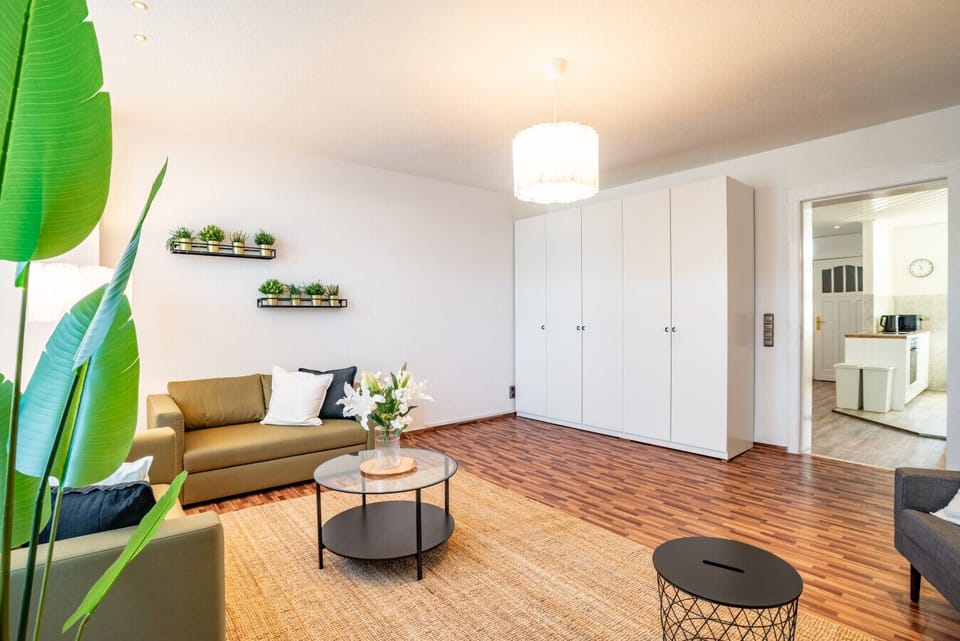 Apartment, 3 Bedrooms (339003) | Living area | 60-inch flat-screen TV with cable channels