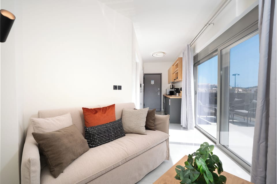 Panoramic Apartment, City View | Living area | 43-inch Smart TV with cable channels