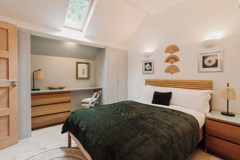 Bedroom 1 - Unwind in style with plush bedding and delightful decorative touches!