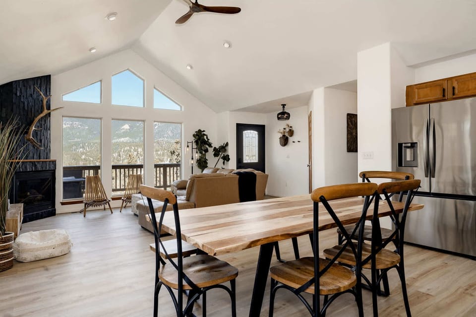 Open concept living space with kitchen, dining and living room.