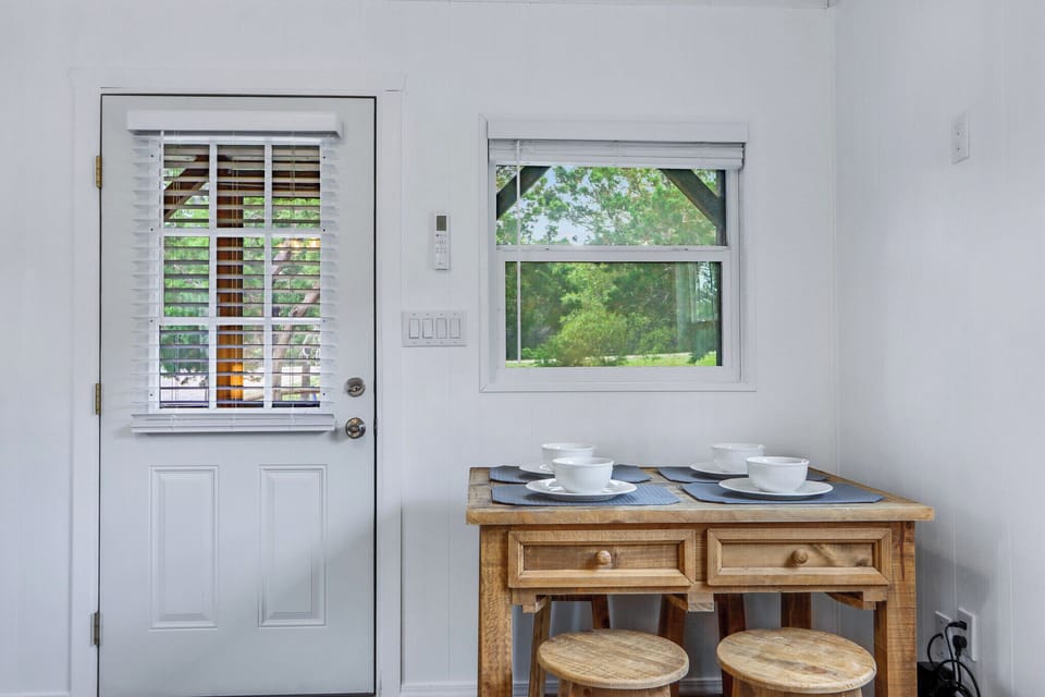 Dining table just inside the door.
