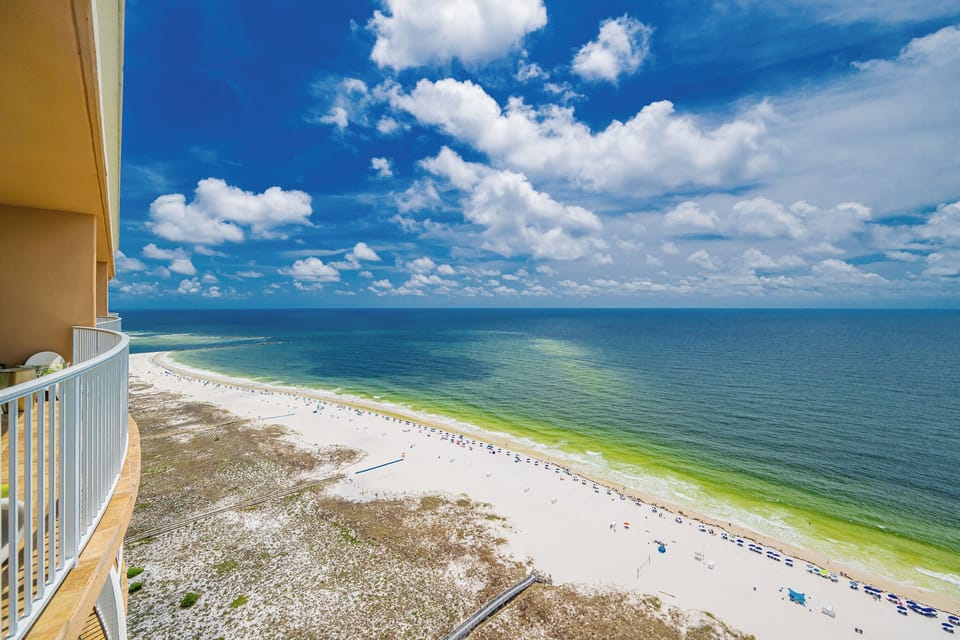 Breathe in the fresh coastal air from your spacious balcony, enjoying stunning views of the tranquil shore