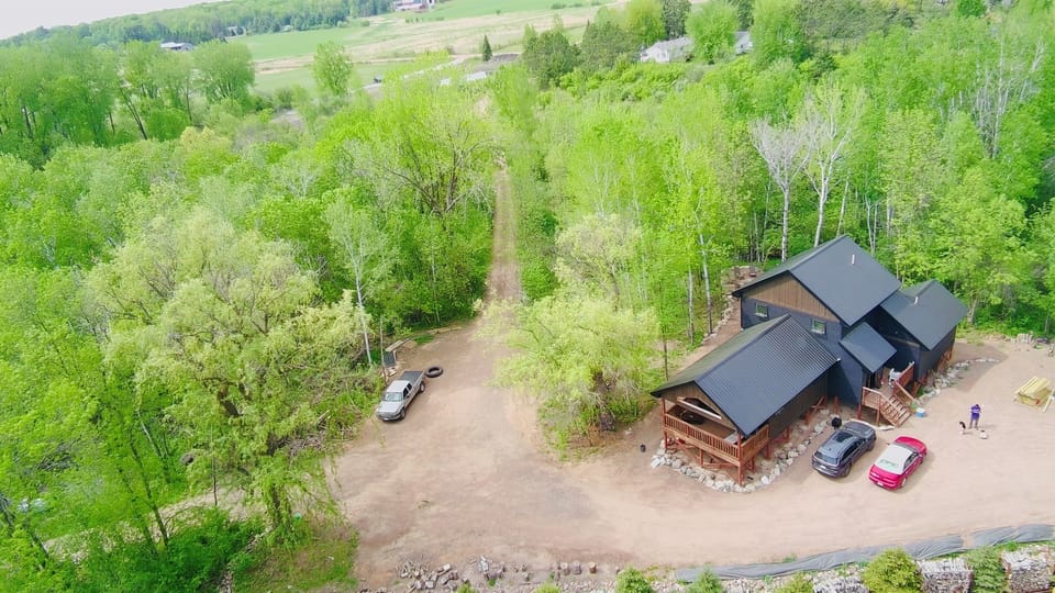 Treehouse in the bay:  Sleeps 10, has a soaking tub and rain showers, lake access, an 8 person sauna, cold tub and Blackstone grill - right in the bay!