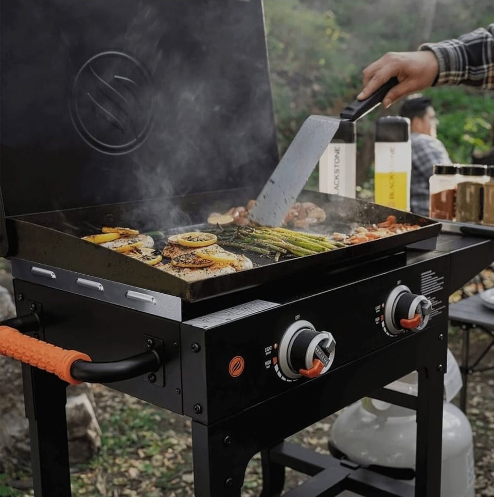 Fire up the flavor! Each treehouse comes with its own Blackstone grill for the perfect outdoor cooking experience! 