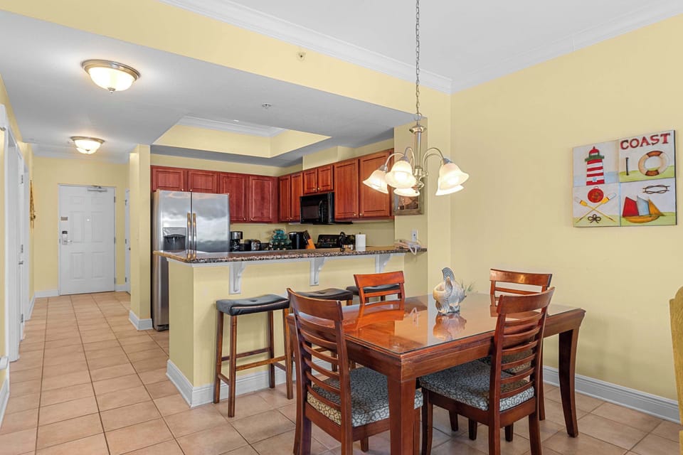Dining table and kitchen.