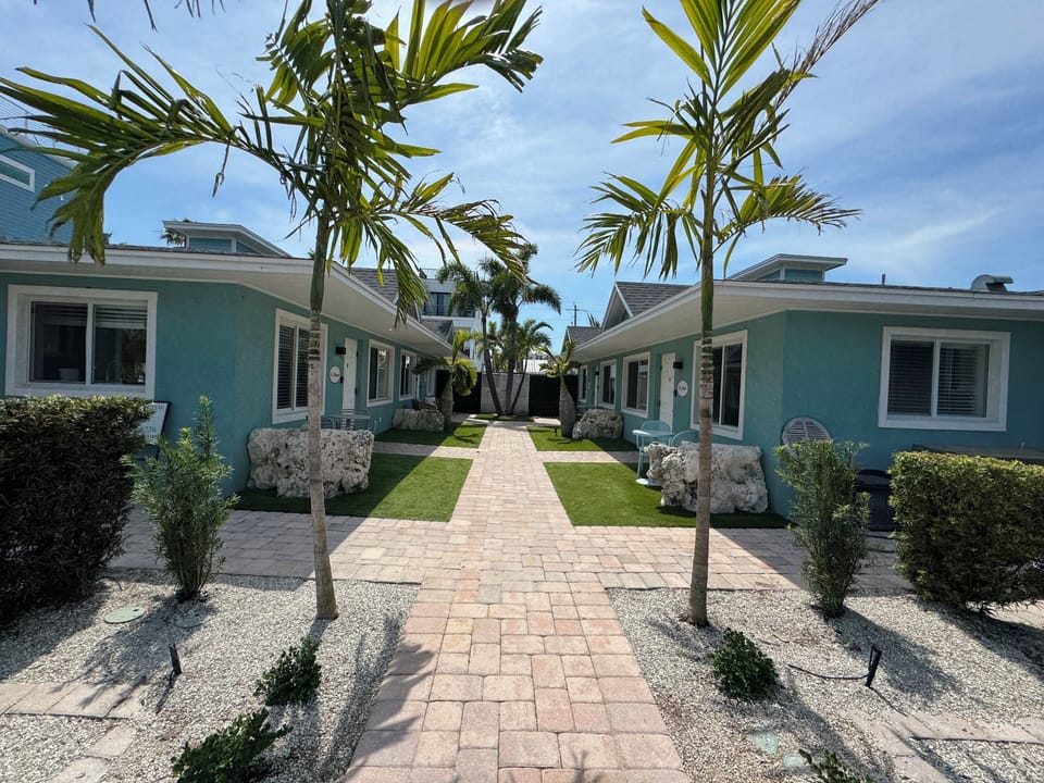 Entrance to 4 unit private compound, with tropical courtyard.