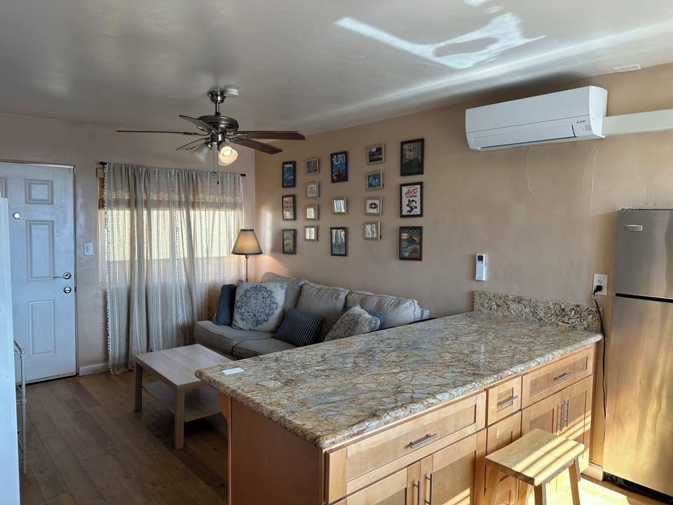 View of Living room from ocean end toward entry.