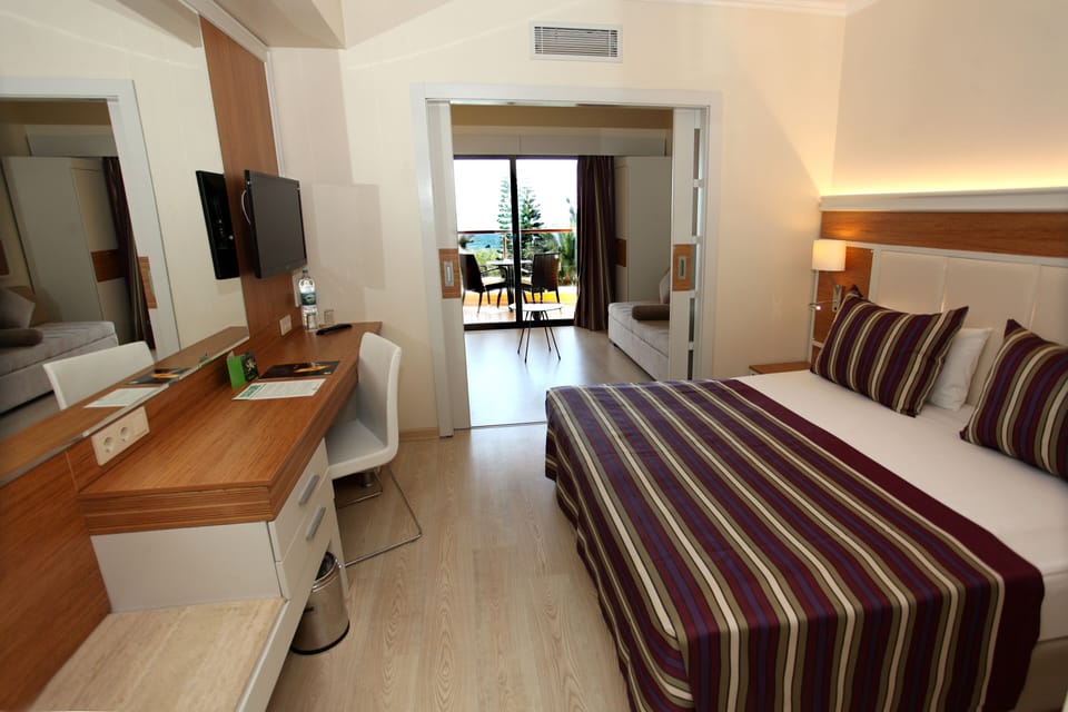 Family Room (Classic, Partial Sea View) | Premium bedding, minibar, in-room safe, desk