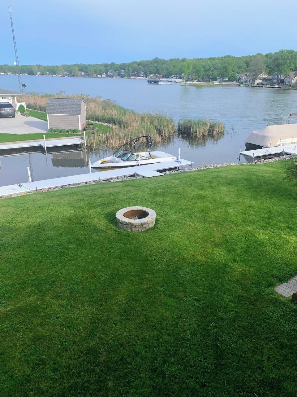 View from deck. Dock and firepit. 