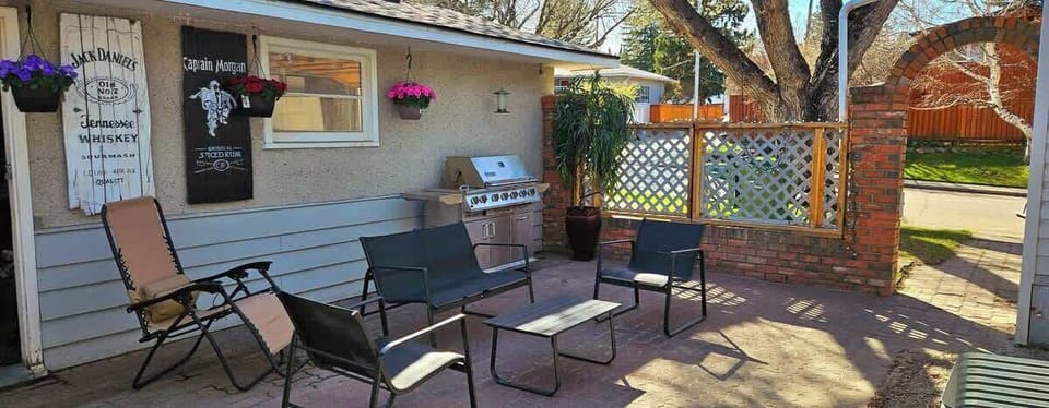 Awesome outdoor patio space with barbecue. Lots of pillows/cushions available (not shown in photo). Outdoor space is shared with main floor stay.