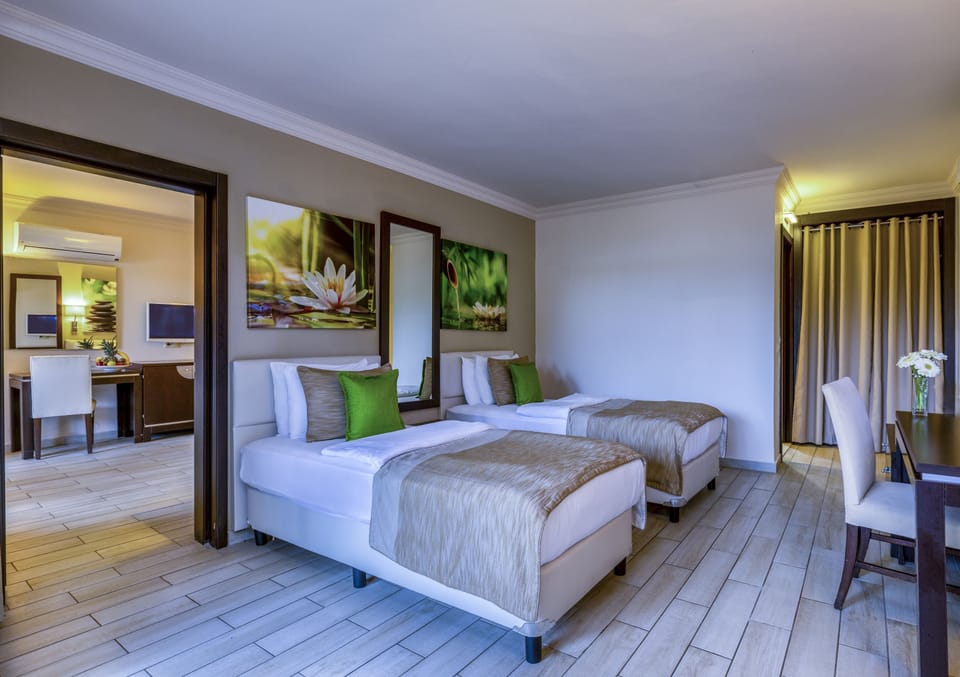 Family Room, 2 Bedrooms, Garden View | Free minibar, in-room safe, soundproofing, free WiFi