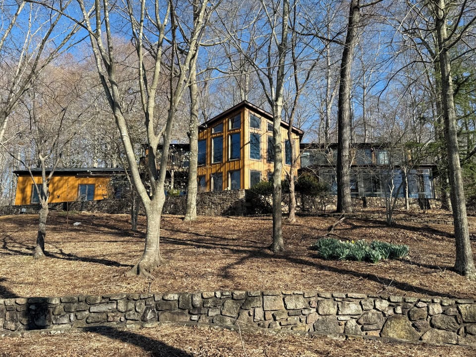 Beautiful recently updated lakefront cedar home with floor to ceiling windows
