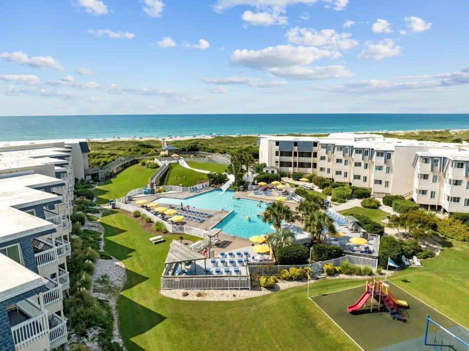 Enjoy direct beach access and family-friendly amenities, including indoor and outdoor pools, a mini-golf course, and a playground, all just steps away from breathtaking views of the ocean.