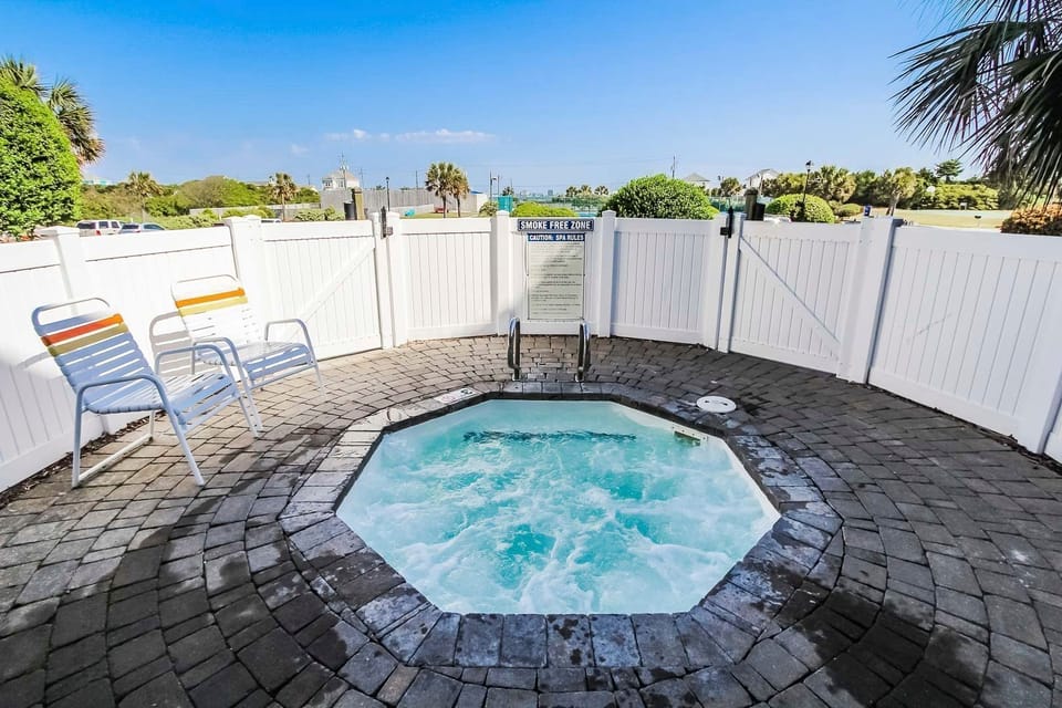 Unwind in the hot tub area, ideal for relaxation after a day of adventure, set within easy reach of the beach and nearby Fort Macon and Morehead City.