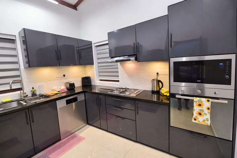 Fully equipped kitchen with modern appliances and a clean stylish design