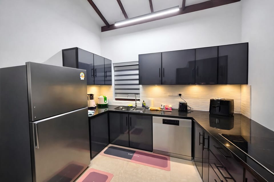 Modern kitchen with essential appliances and a clean, functional design