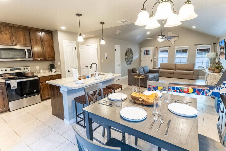 Open-concept kitchen, dining, and living area — ideal for gathering and entertaining.