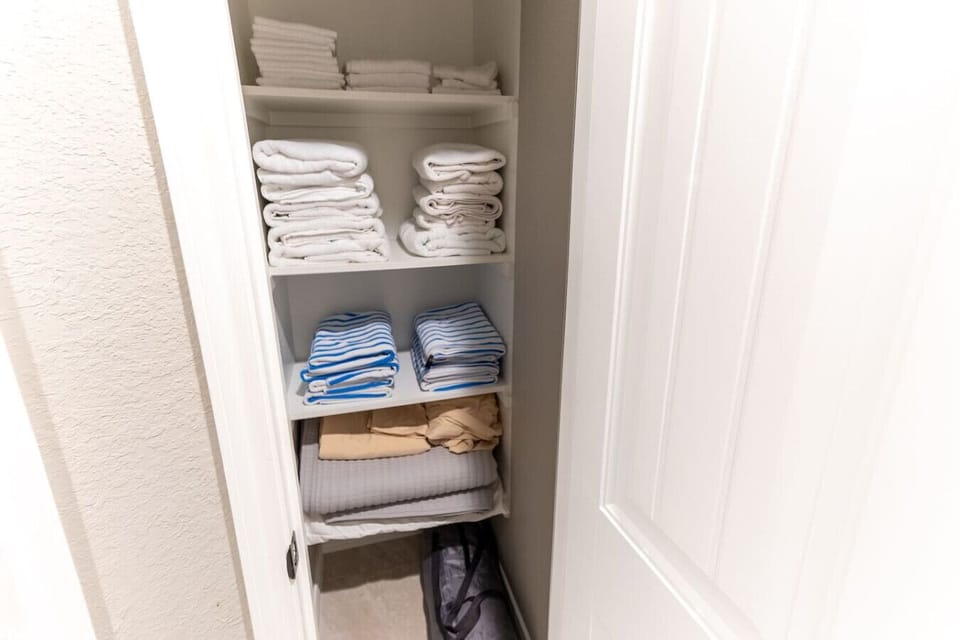 Fully stocked linen closet — fresh towels, bedding, and extras for every stay.