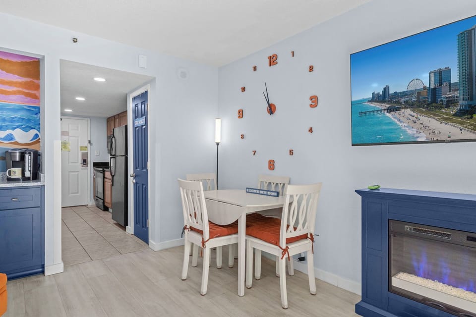 Dining by fireplace glow — breakfast before the beach or takeout after. The vibe is always right.