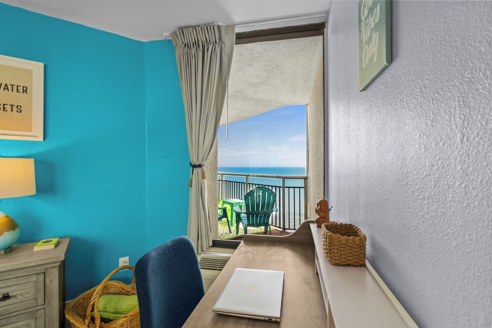 If you have to work on vacation, this is the way to do it—desk by the window, ocean air, and a view that makes emails feel shorter.
