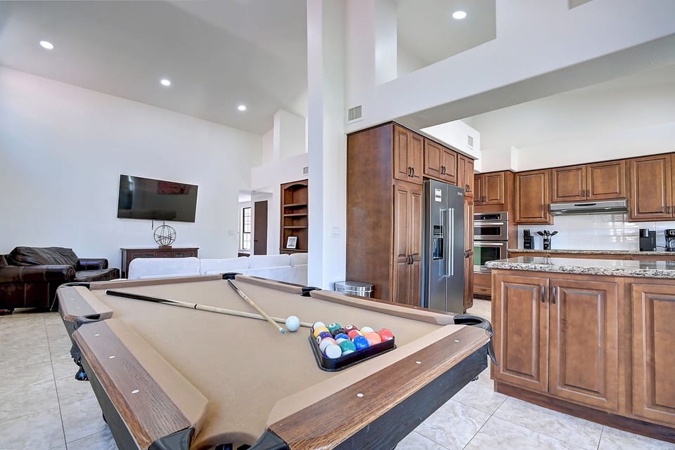 Family room with novelty billiards, chefs kitchen and amazing golf course views.
