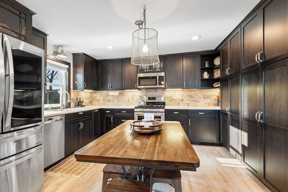 Cook in style with a fully updated kitchen featuring stainless steel appliances and warm finishes