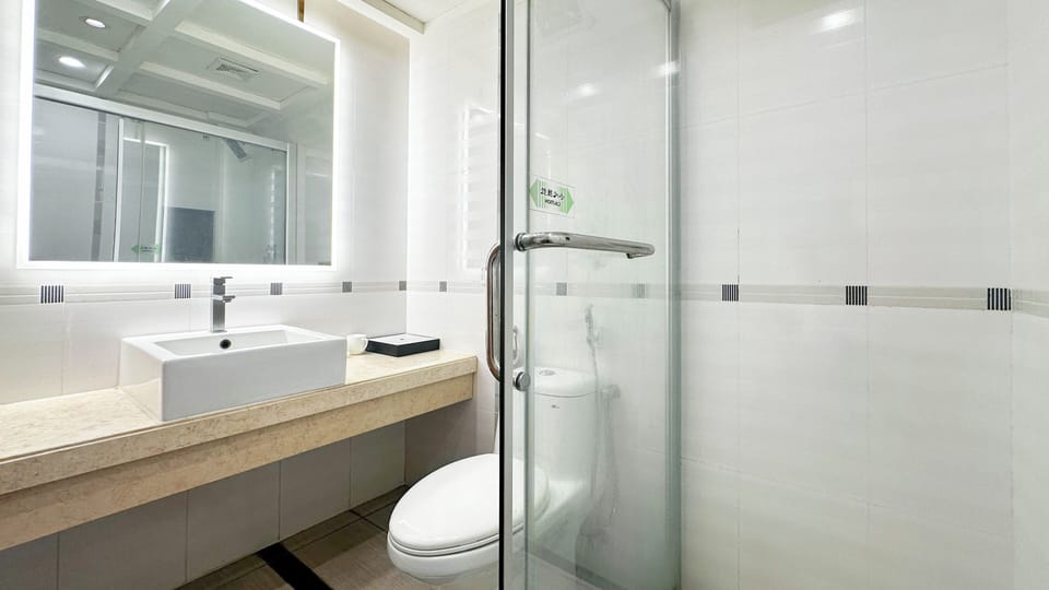 Shower, hair dryer, slippers, towels