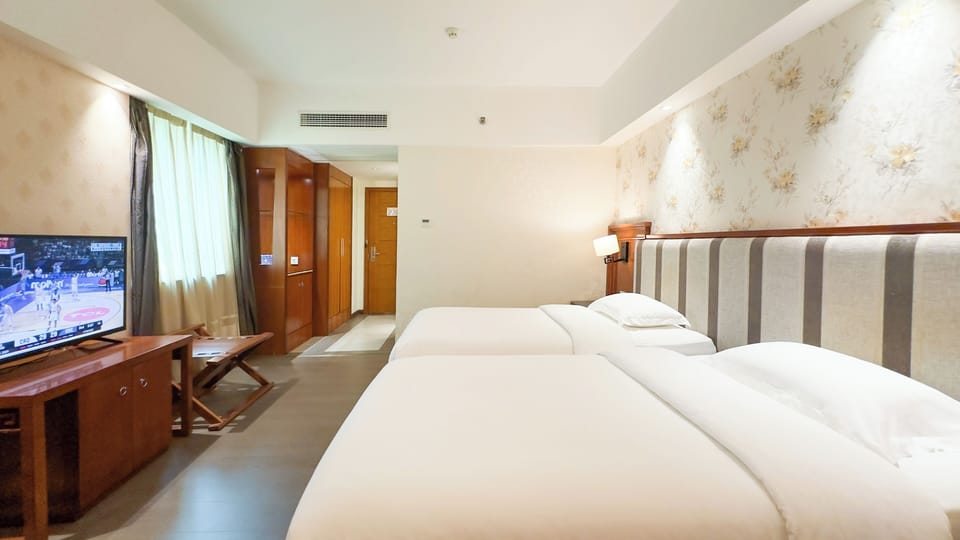 Premium bedding, down comforters, memory foam beds, free minibar