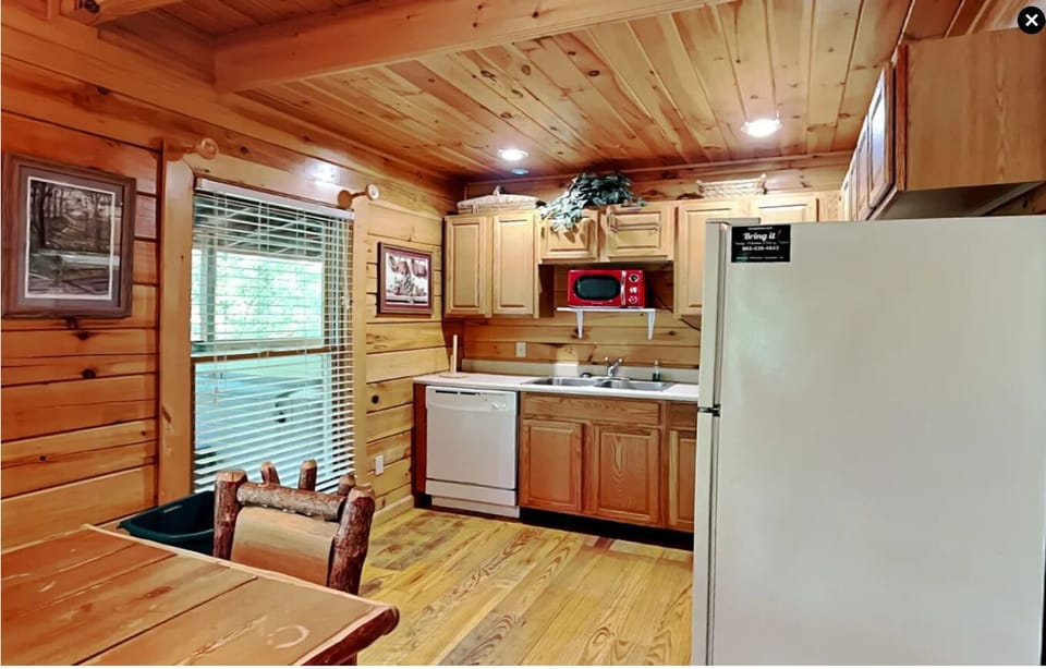 Kitchen with refrigerator, microwave, oven, dishwasher, etc.