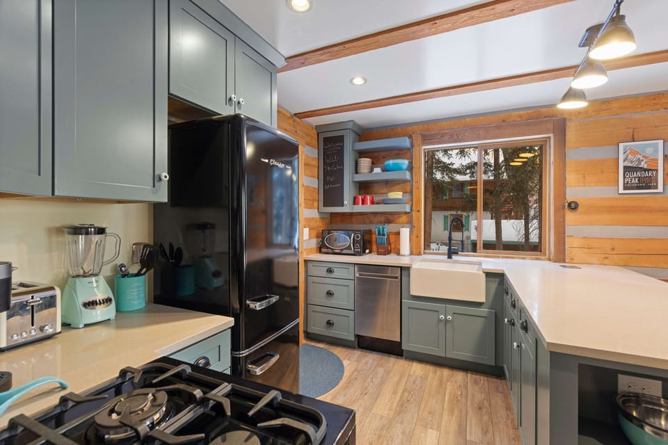 Kitchen: Main floor, drip coffee maker, Keurig, toaster, cooking utensils, tableware