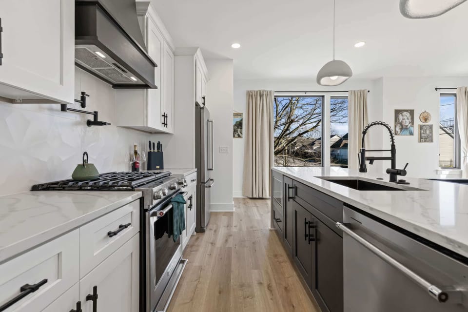 Large kitchen island puts the cook in the middle of the action, so nobody gets left out while meals come together for 24