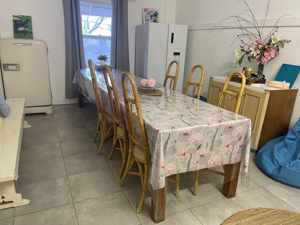 Dining room with the historical wooden table that can seat up to 12 people. 