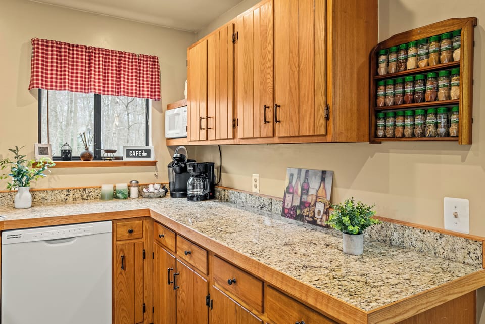 Granite countertops and warm wood tones add style and function.