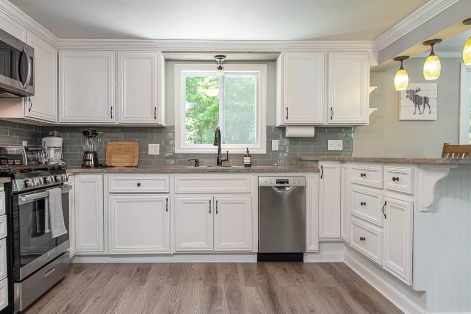 The fully equipped kitchen with granite countertops is ready for your MasterChef skills.