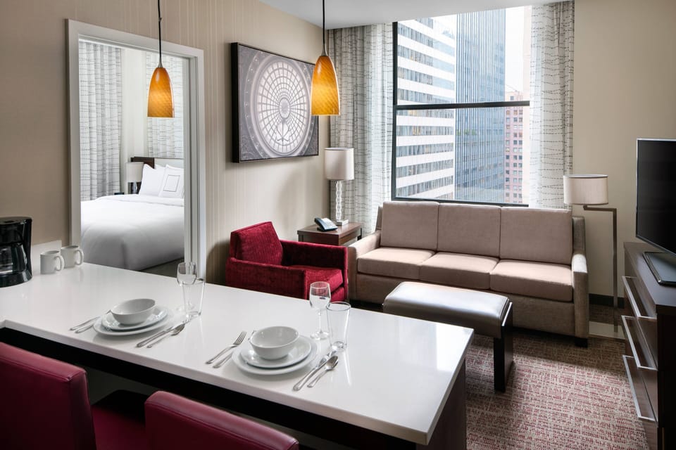 Premium bedding, desk, laptop workspace, iron/ironing board