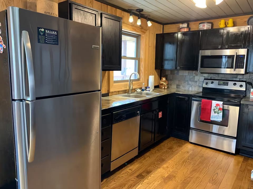 Sleek stainless appliances meet rustic charm – perfect for your culinary adventures!