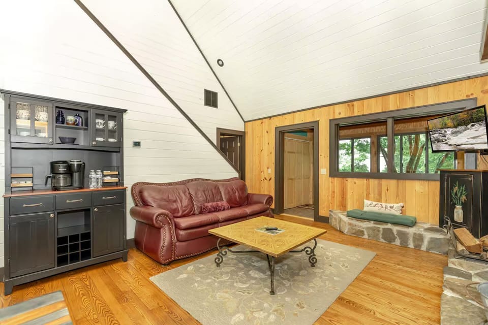 Relax in stylish comfort, with ample natural light and stunning wooded views!