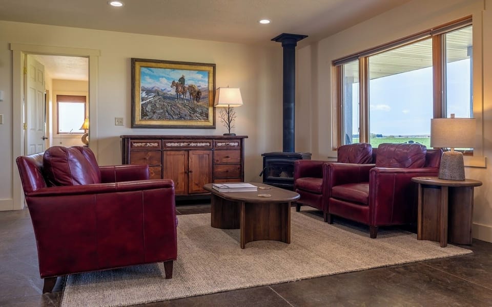 Main level living area features original Western artwork and stylish Mountain Modern furnishings