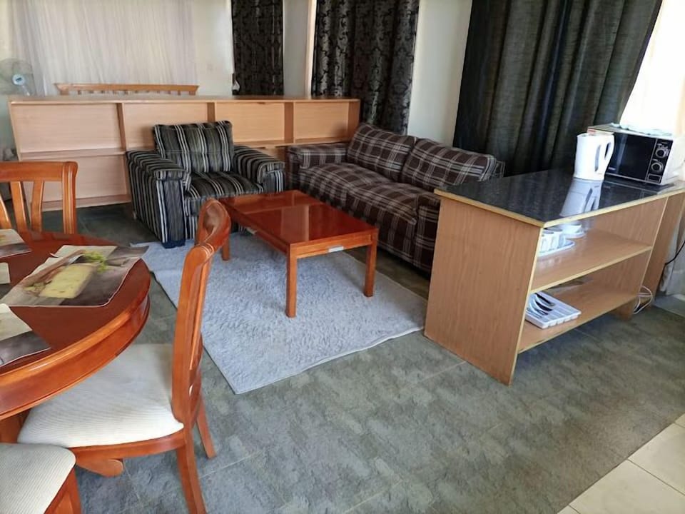 Apartment, Garden View | Living area | 24-inch Smart TV with digital channels