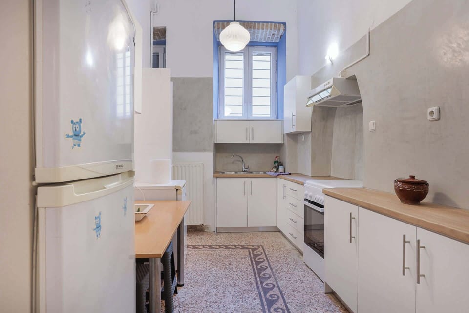View of the Kitchen – Neat and spacious kitchen with ample counter space.