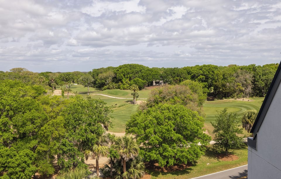 Enjoy golf course views from the private balcony off the queen bedroom