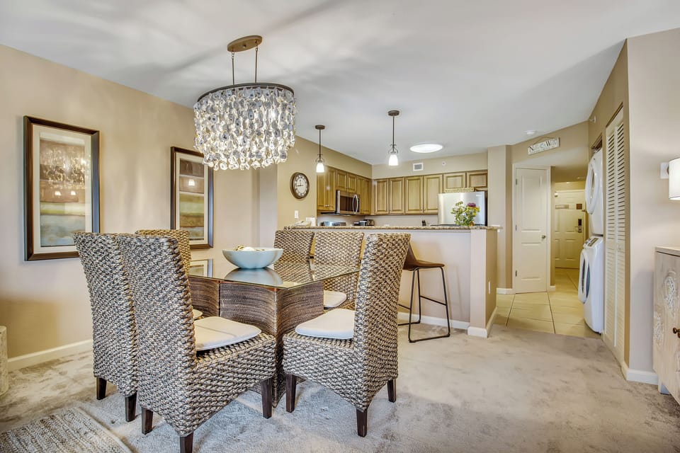 Your elegant dining room sparkles under a crystal chandelier, perfect for memorable meals in this beautifully appointed space.