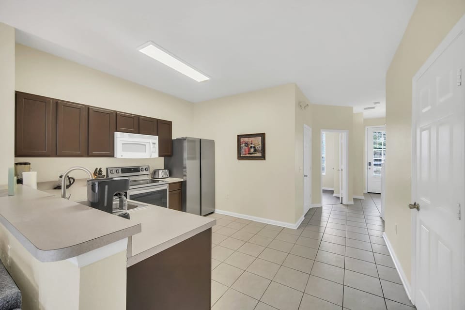 Modern Open Kitchen with Stainless Steel Appliances and Spacious Layout