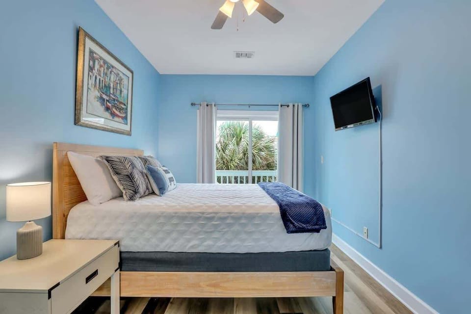Bedroom with soft colors and natural textures for a beachy vibe. 