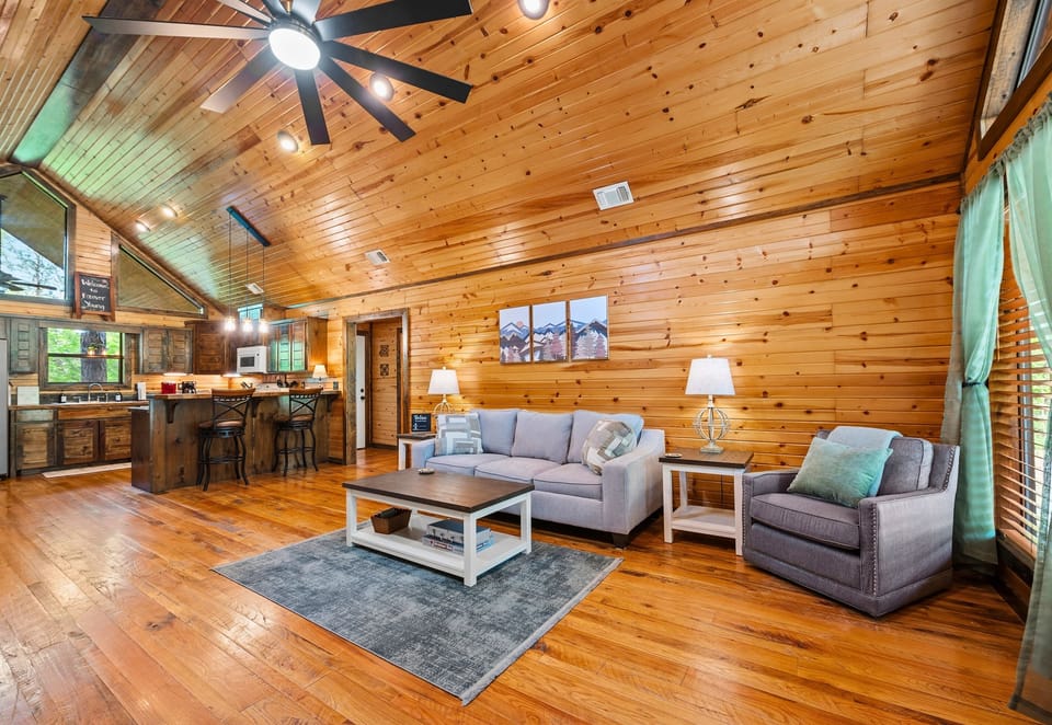 Sunlight filters through the windows, filling the living area with a cozy glow that's perfect for lazy afternoons.