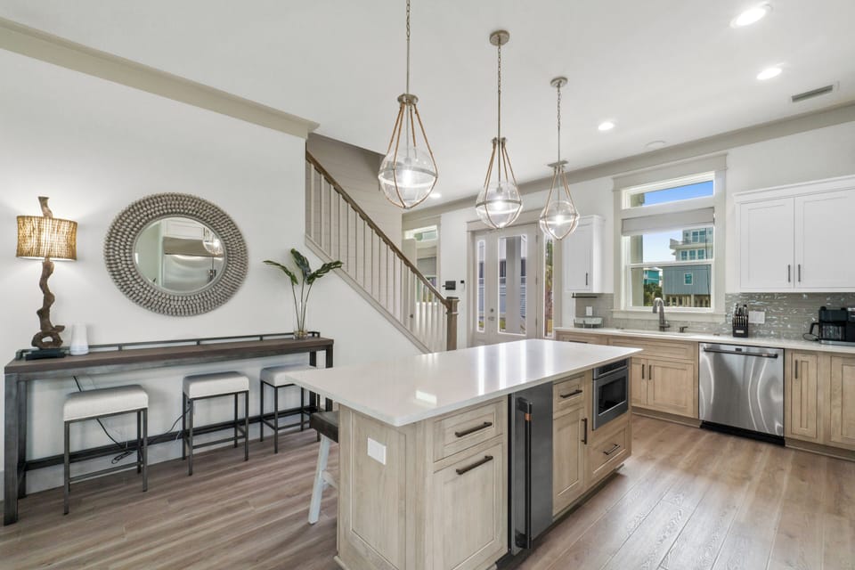 Your modern kitchen blends elegance with functionality, featuring a spacious island perfect for morning coffee and meal prep.