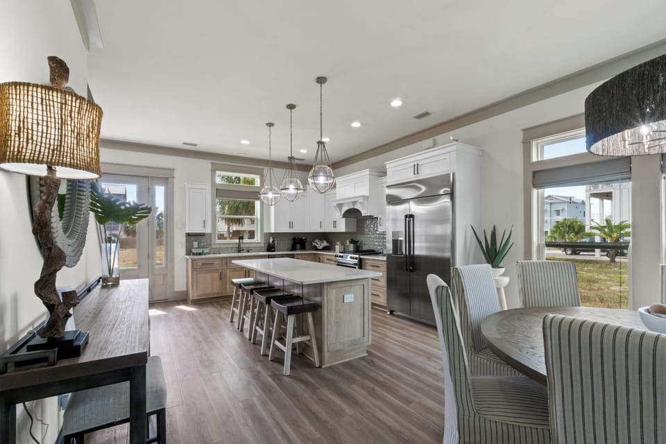 Your gourmet kitchen awaits with sleek appliances, island seating, and stylish pendant lighting for memorable meal prep and conversations.