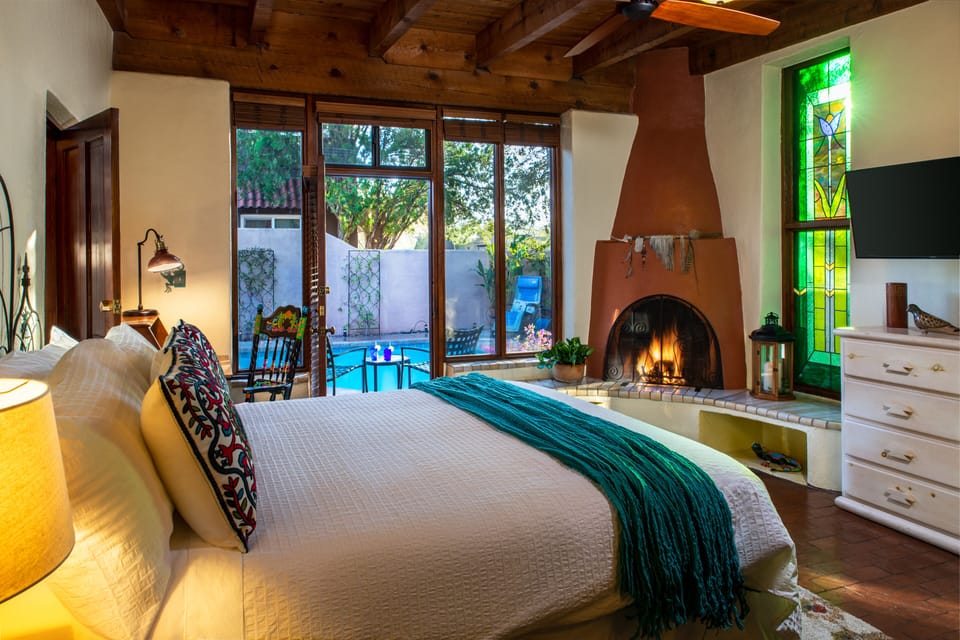 Deluxe Room, 1 King Bed, Fireplace, Pool View | Iron/ironing board, WiFi (free), individually decorated