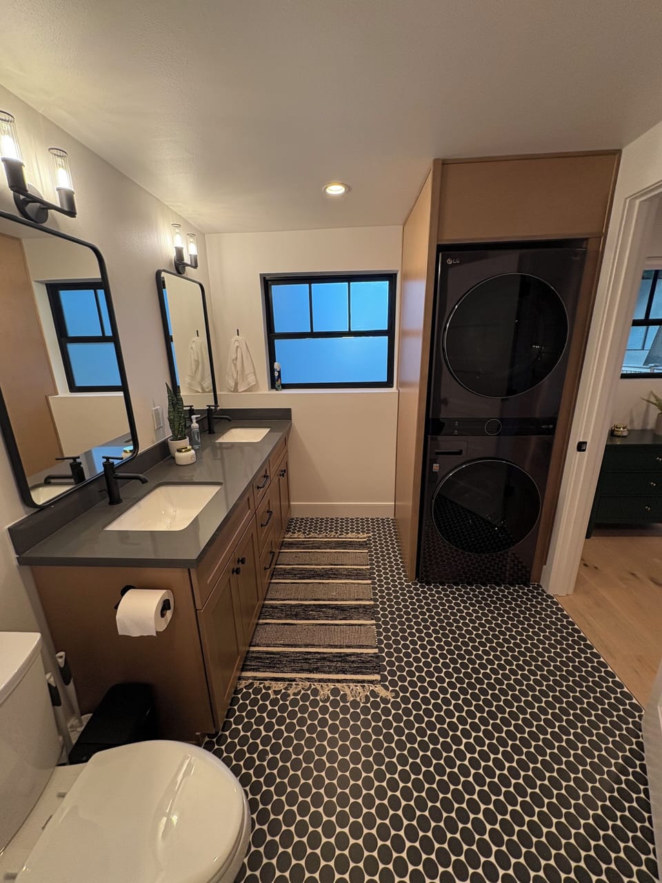 Full bath with full size washer and dryer