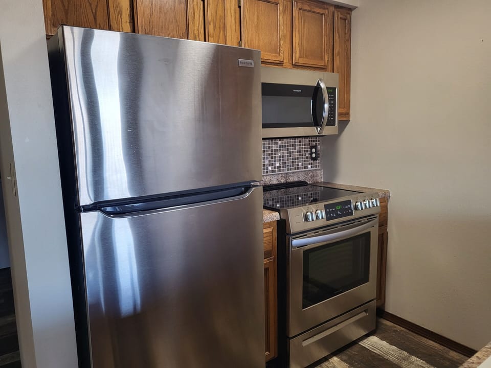 stainless steel refrigerator, stove and microwave